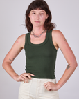 Alex is 5'8" and wearing P Tank Top in Swamp Green