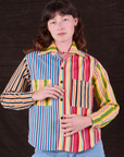 Alex is wearing a buttoned up Cropped Overshirt in Mixed Stripe