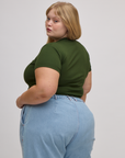 Angled back view of Baby Tee in Evergreen on Juliet