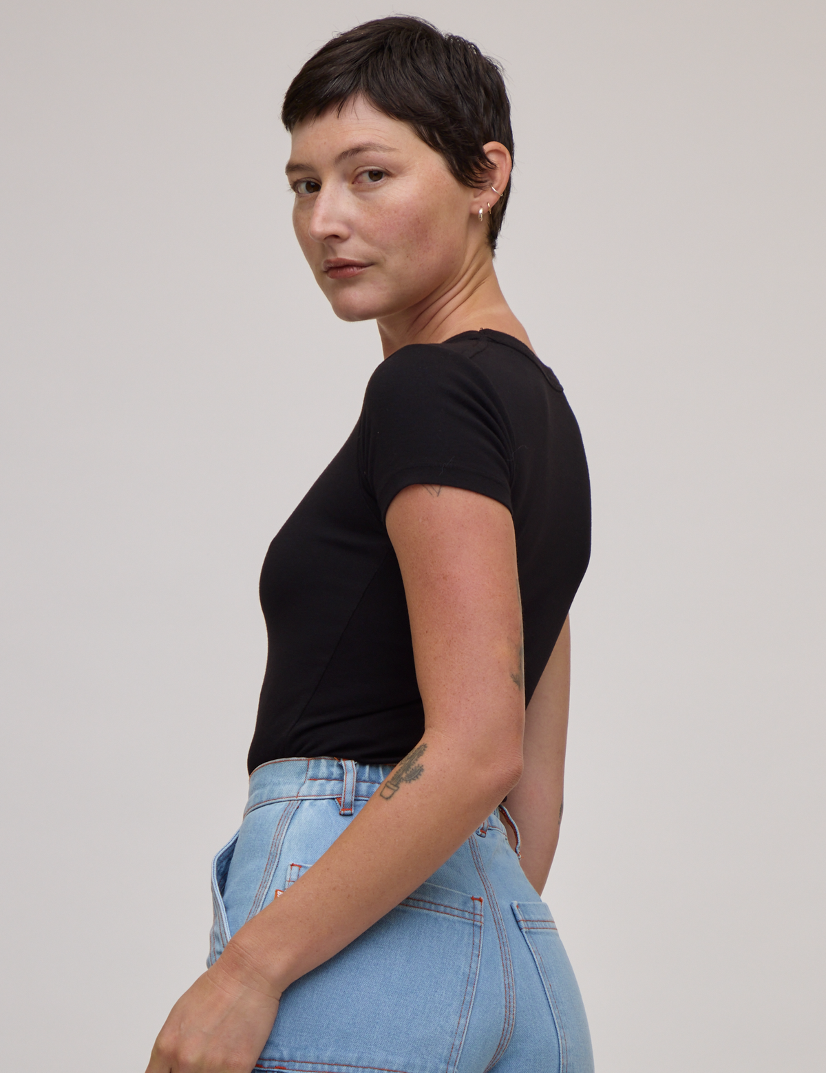 Baby Tee in Basic Black side view on Alex