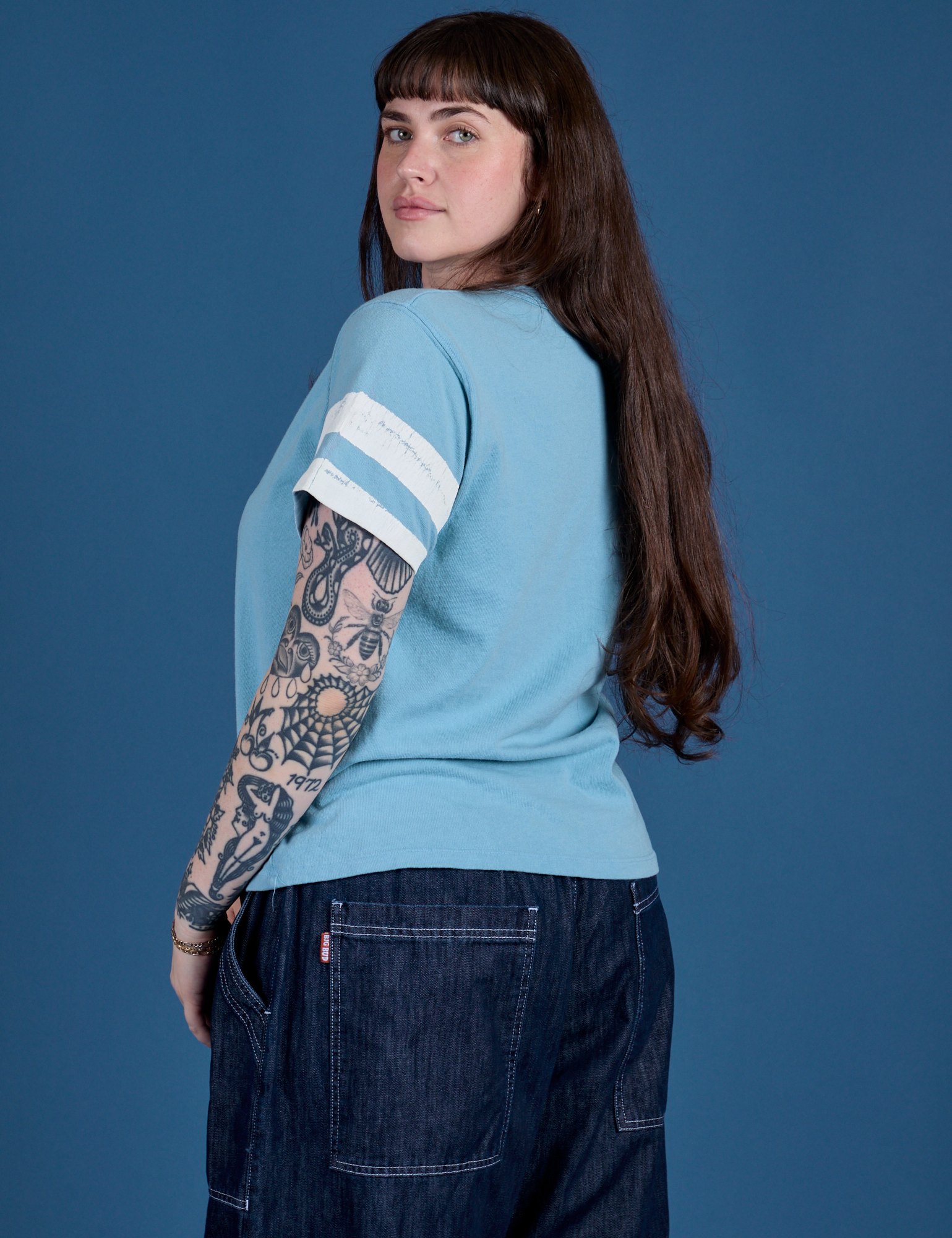 Painted Burly Tee in Baby Blue angled back view on Sydney