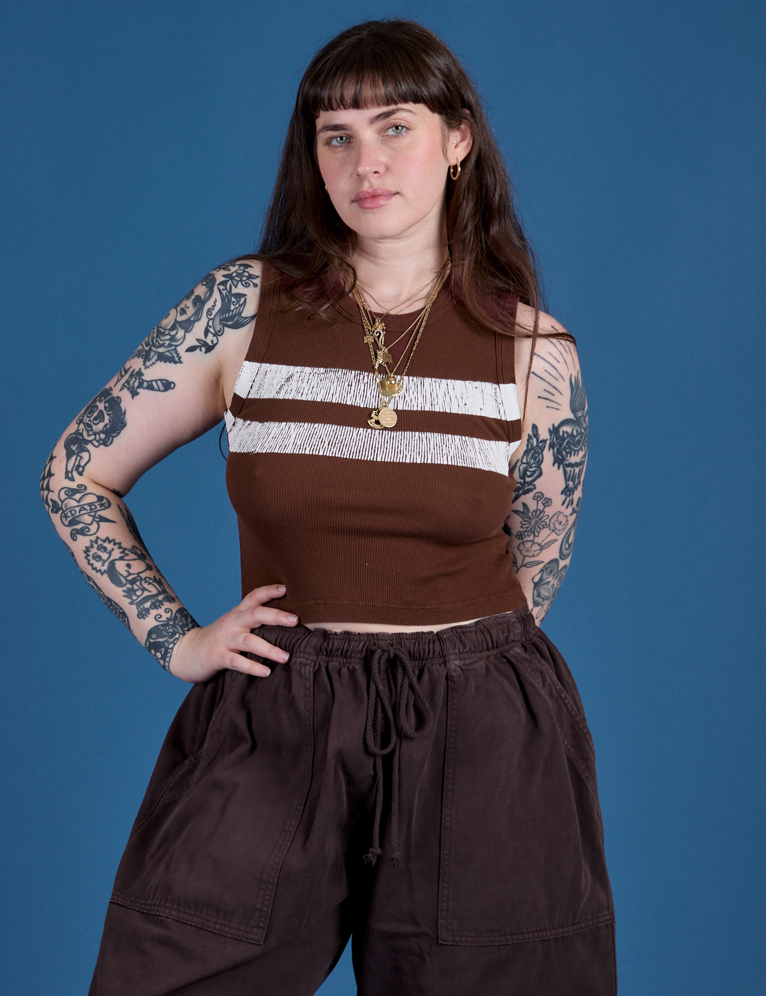 Sydney is 5’9” and wearing XXS Painted Muscle Tee in Fudgesicle Brown