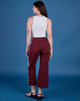 Back view of Painted Action Pants in Red Wine and vintage tee white Cropped Tank