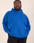 Elijah is 6'0" and wearing 2XL Oversized Hoodie in Royal Blue