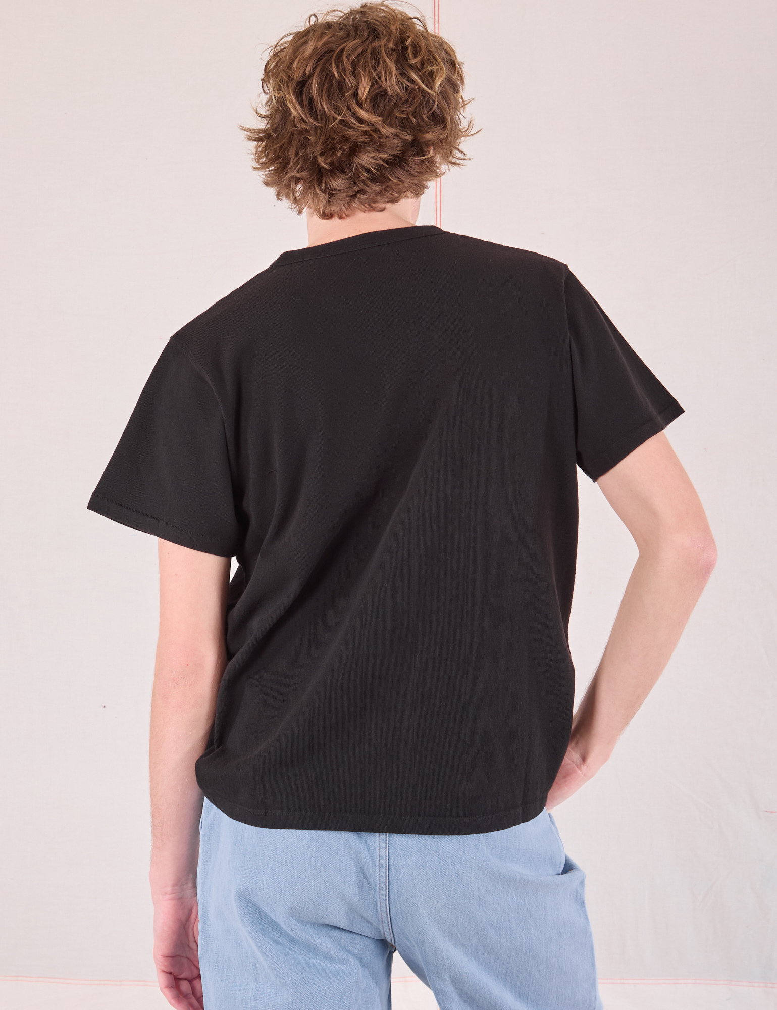 Burly Tee in Basic Black back view on Quinn