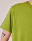 Burly Tee in Gross Green front sleeve close up on Quinn