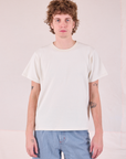 Quinn is 6'3" and wearing S Burly Tee in Vintage Tee Off-White