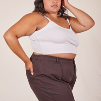 Side view of Cropped Cami in Vintage Off-White and espresso brown Western Pants worn by Alicia