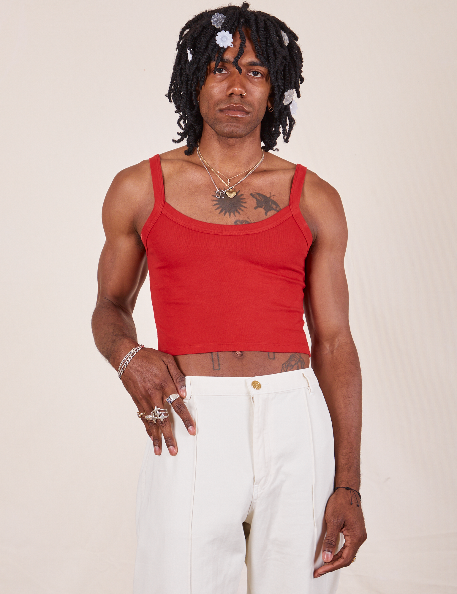 Jerrod is 6&#39;3&quot; and wearing S Cropped Cami in Mustang Red paired with vintage off-white Western Pants