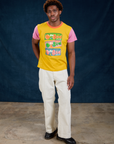 Isaac is wearing Vintage Tee in Bubblegum and Western Pants in Vintage Tee Off-White