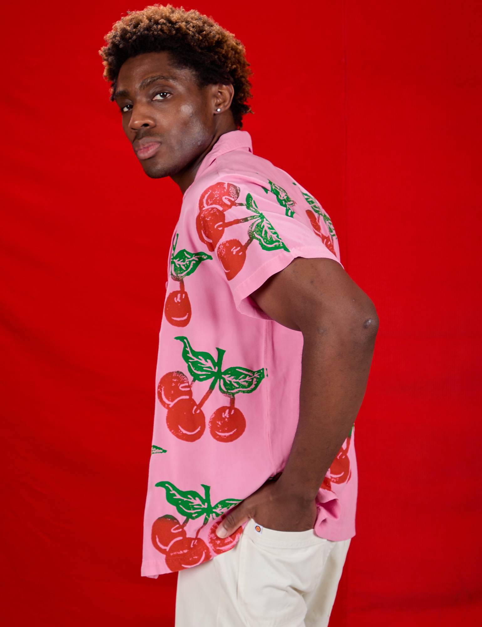 Cherry Pantry Button-Up side view on Isaac