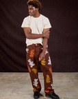 Isaac is 5'10" and wearing M Gummy Bear Paintstamped Work Pants in Fudgesicle Brown paired with Organic Vintage Tee in Vintage Off-White