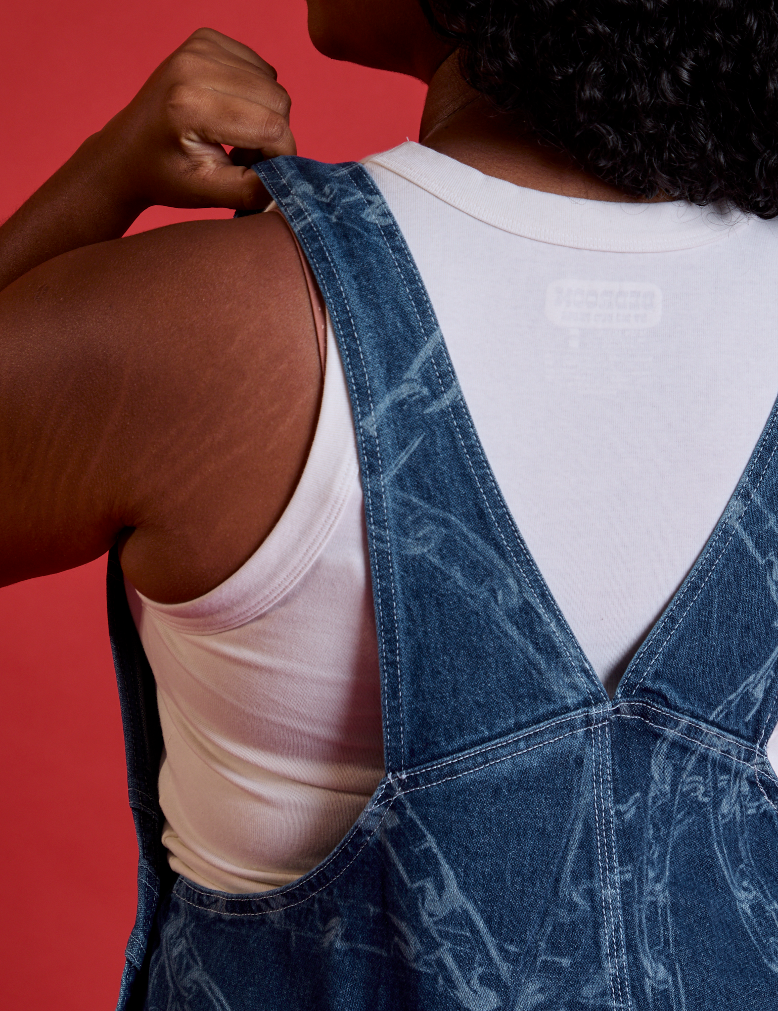 Back strap close up of Carpenter Overalls in Chain Link on Meghna