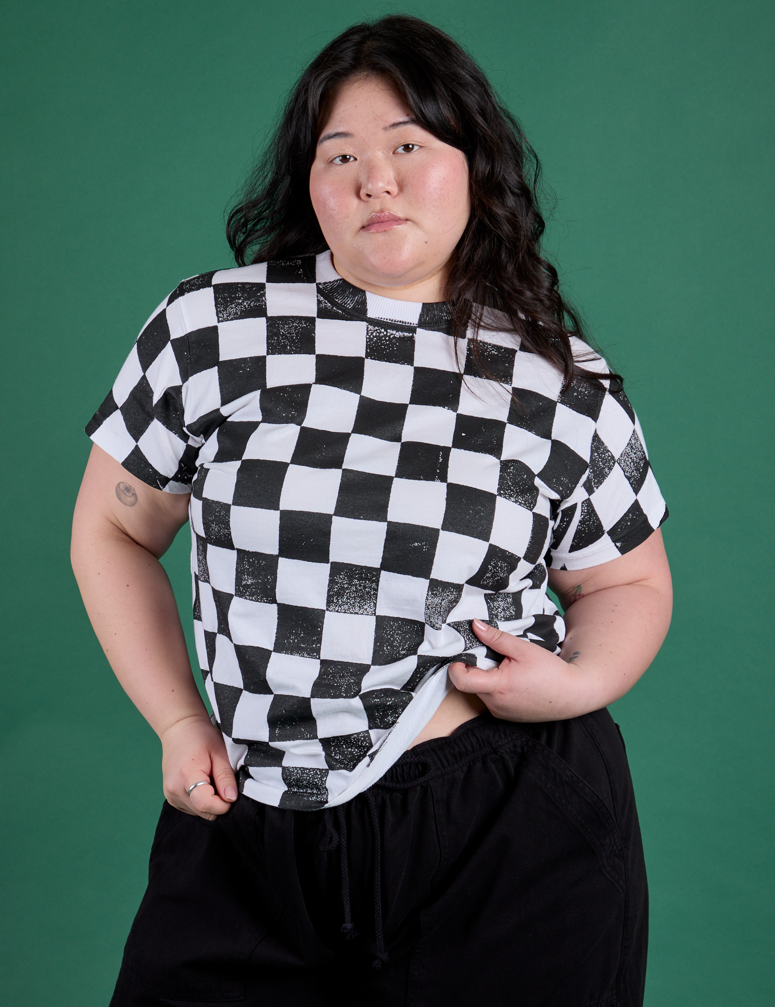 Ashley is 5'7" and wearing L Checker Organic Tee in Black