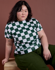 Ashley has on the Checker Organic Tee in Swamp Green