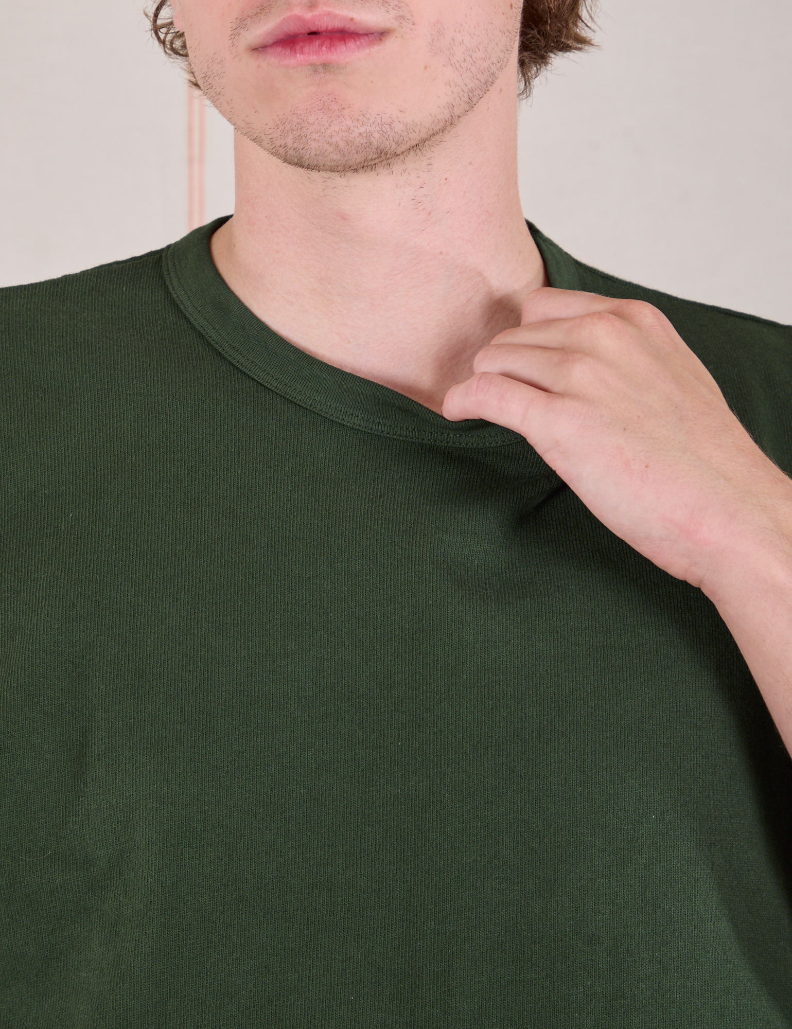 Cropped Burly Tee in Swamp Green front close up on Quinn