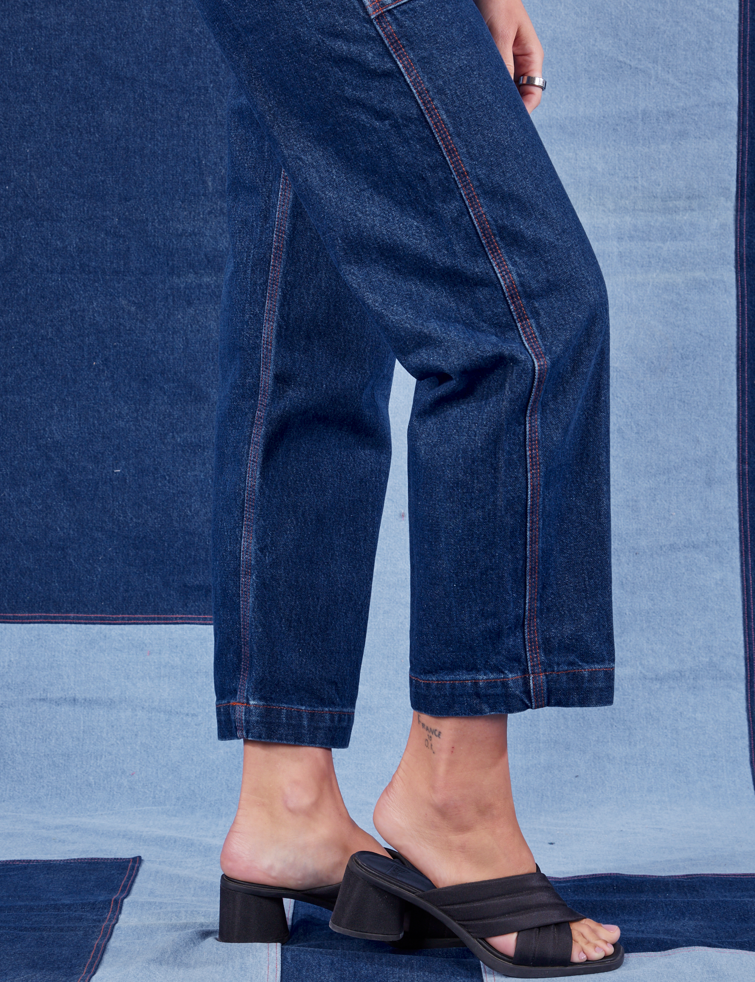 Indigo Denim Original Overalls in Dark Wash pant let side close up on Alex