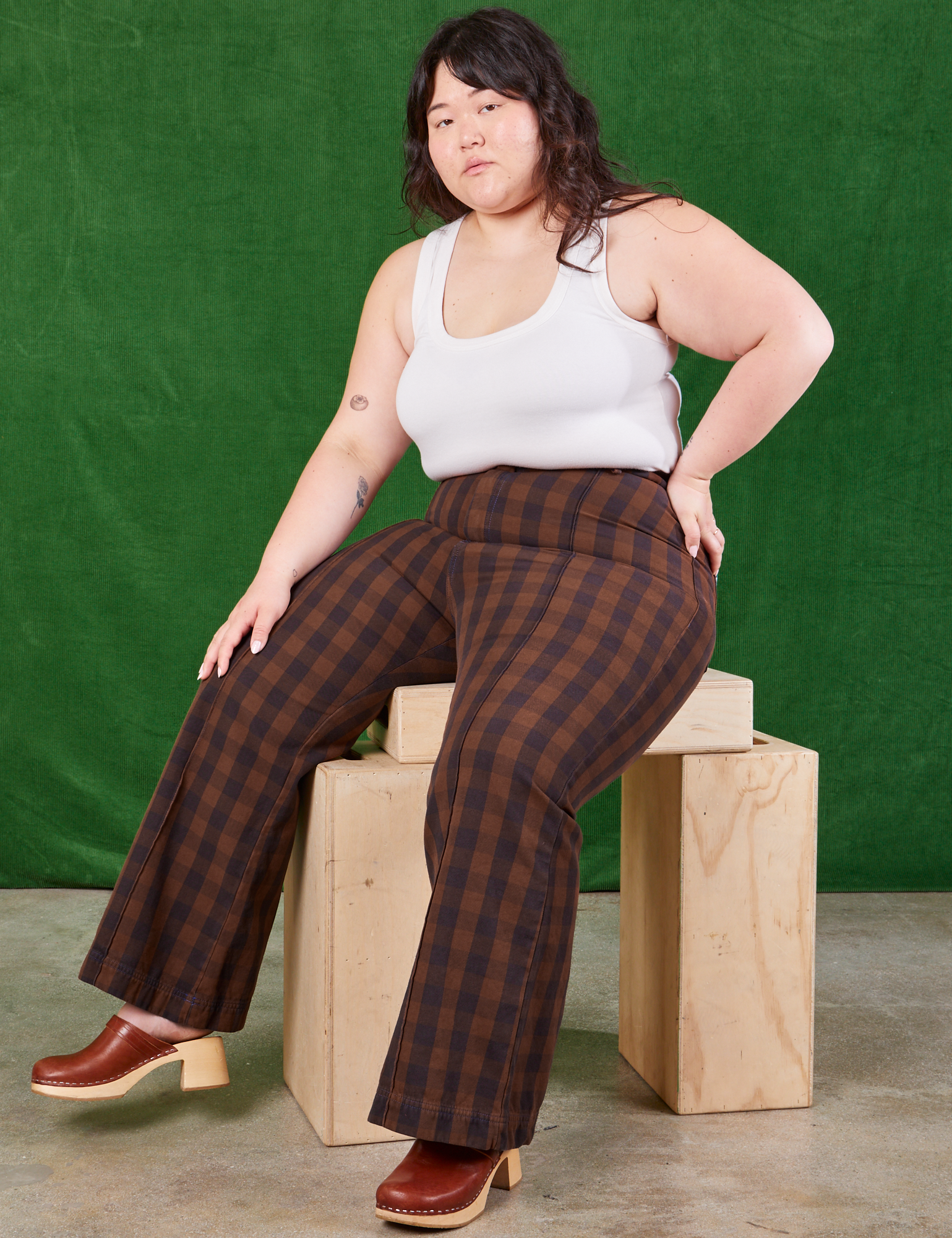 Ashley is wearing Gingham Western Pants in Fudge Brown and Cropped Tank in vintage tee off-white