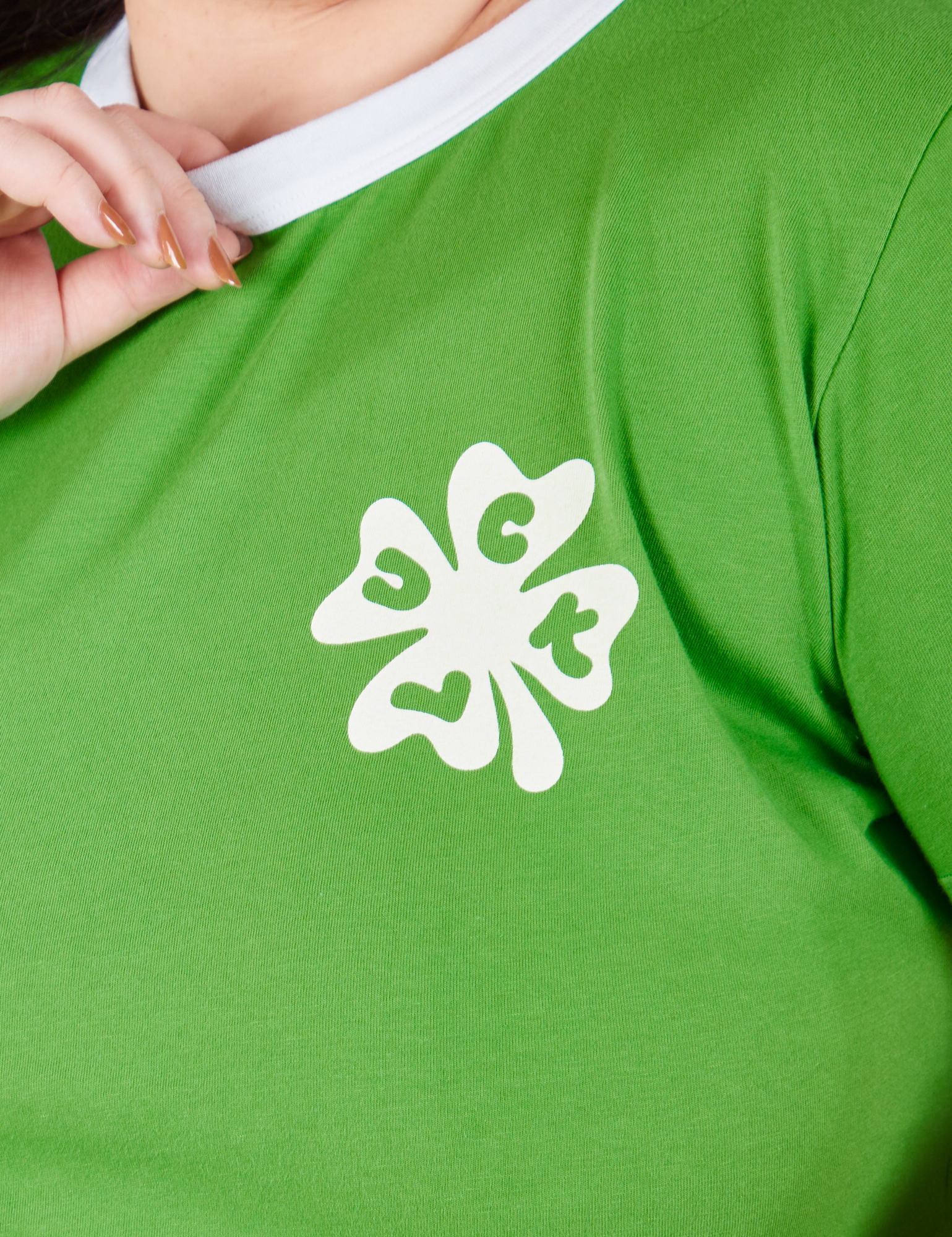 Front close up of Luck Tee on Ashley.
