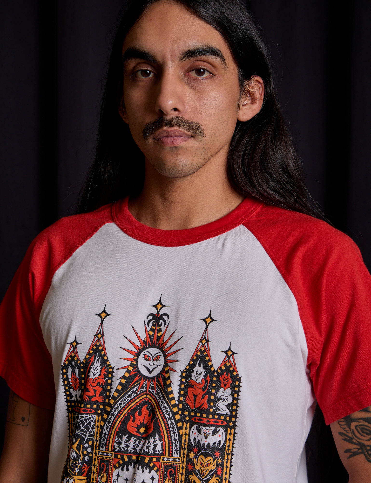 Short Sleeve Raglan Tee in Gates of Hell front close up on Anthony
