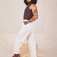 Side view of Heavyweight Trousers in Vintage Off-White and espresso brown Sleeveless Turtleneck worn by Jesse