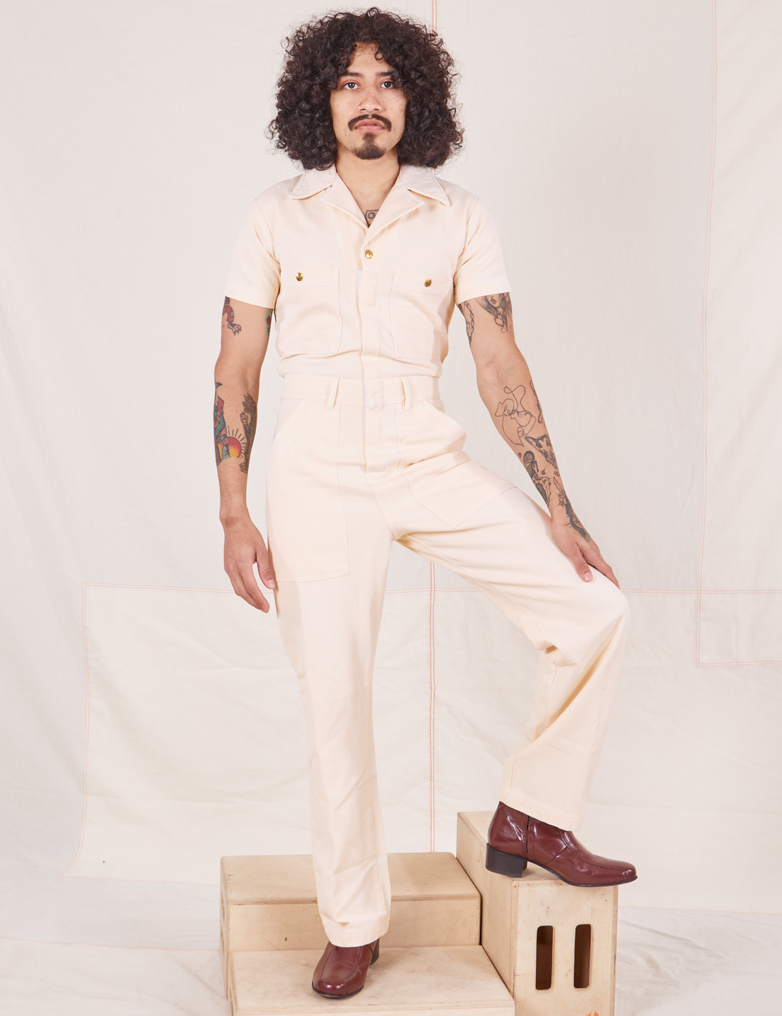 Jesse is 5'8" and wearing size S Heritage Short Sleeve Jumpsuit in Natural