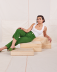 Soraya is wearing Heritage Westerns in Lawn Green and vintage off-white Cropped Tank Top