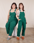 Ashley and Hana are both wearing Original Overalls in Mono Hunter Green