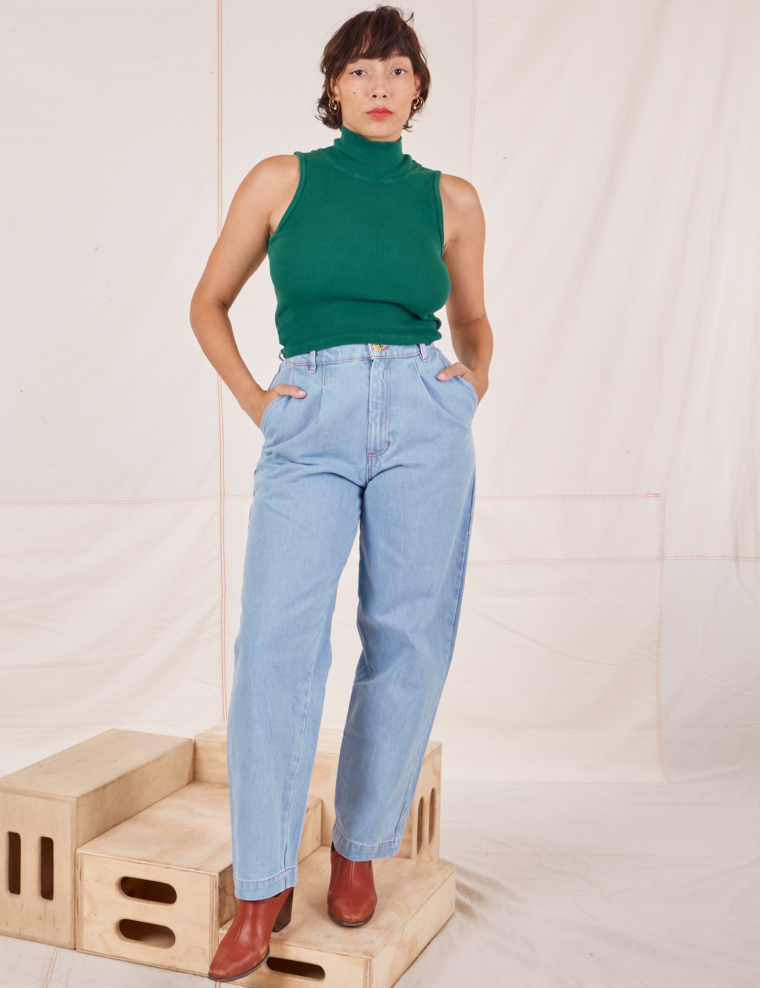 Tiara is 5&#39;4&quot; and wearing XS Sleeveless Essential Turtleneck in Hunter Green