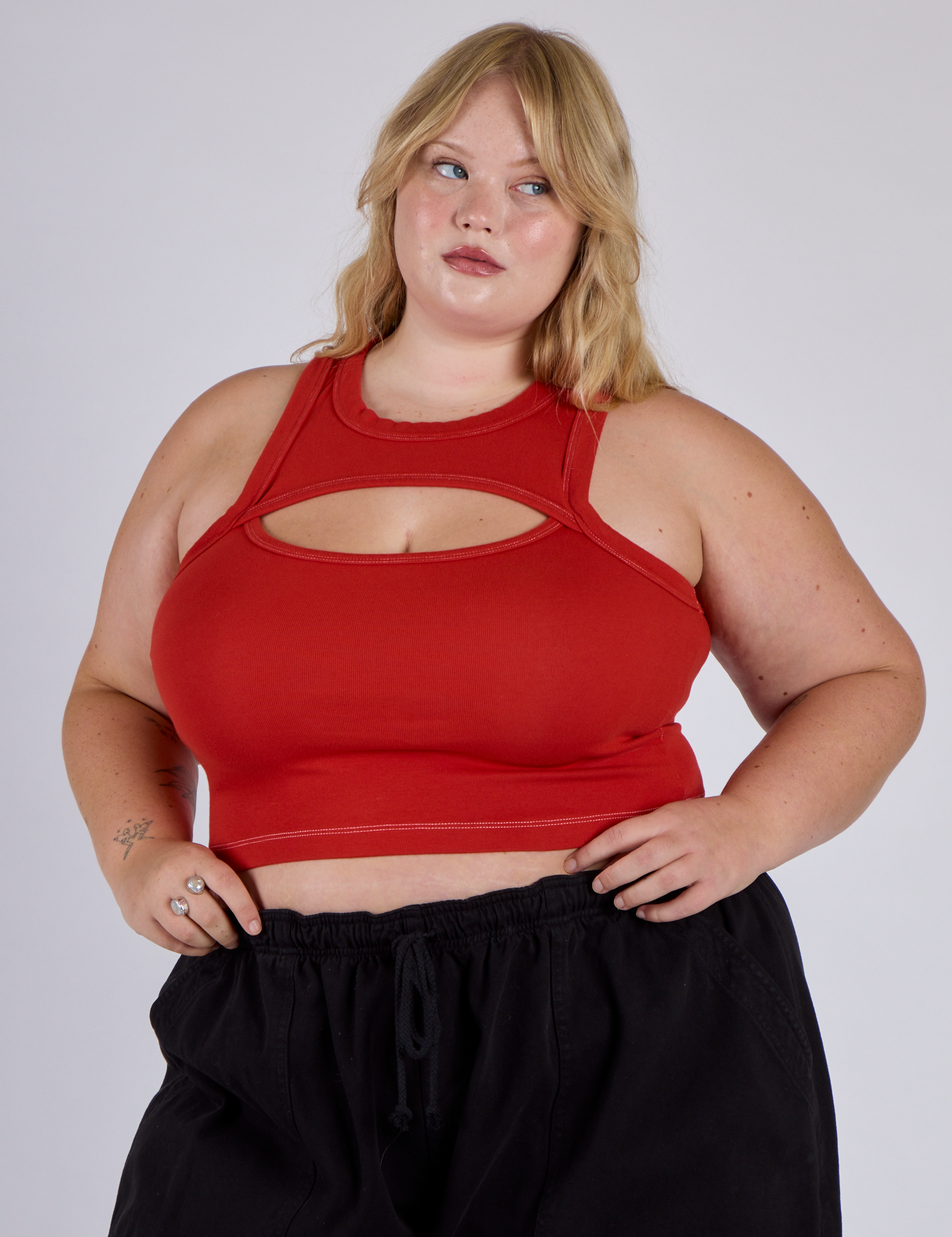 Juliet is 5’7” and wearing L Porthole Tank in Mustang red