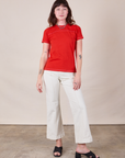 Alex is wearing JV Tee in Mustang Red paired with vintage tee off-white Western Pants