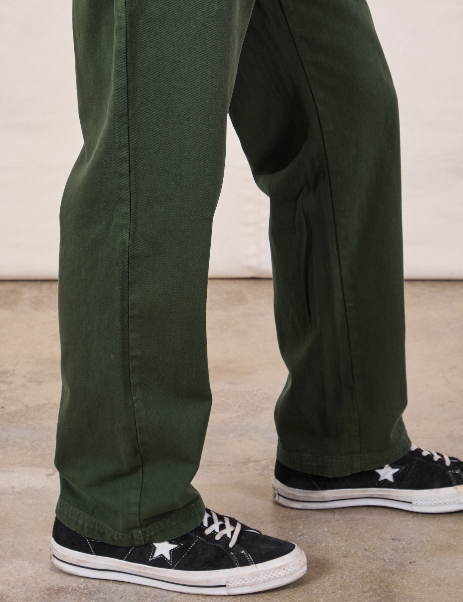 Long Jumpsuit in Swamp Green pant leg close up on Jerrod