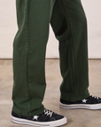 Long Jumpsuit in Swamp Green pant leg close up on Jerrod