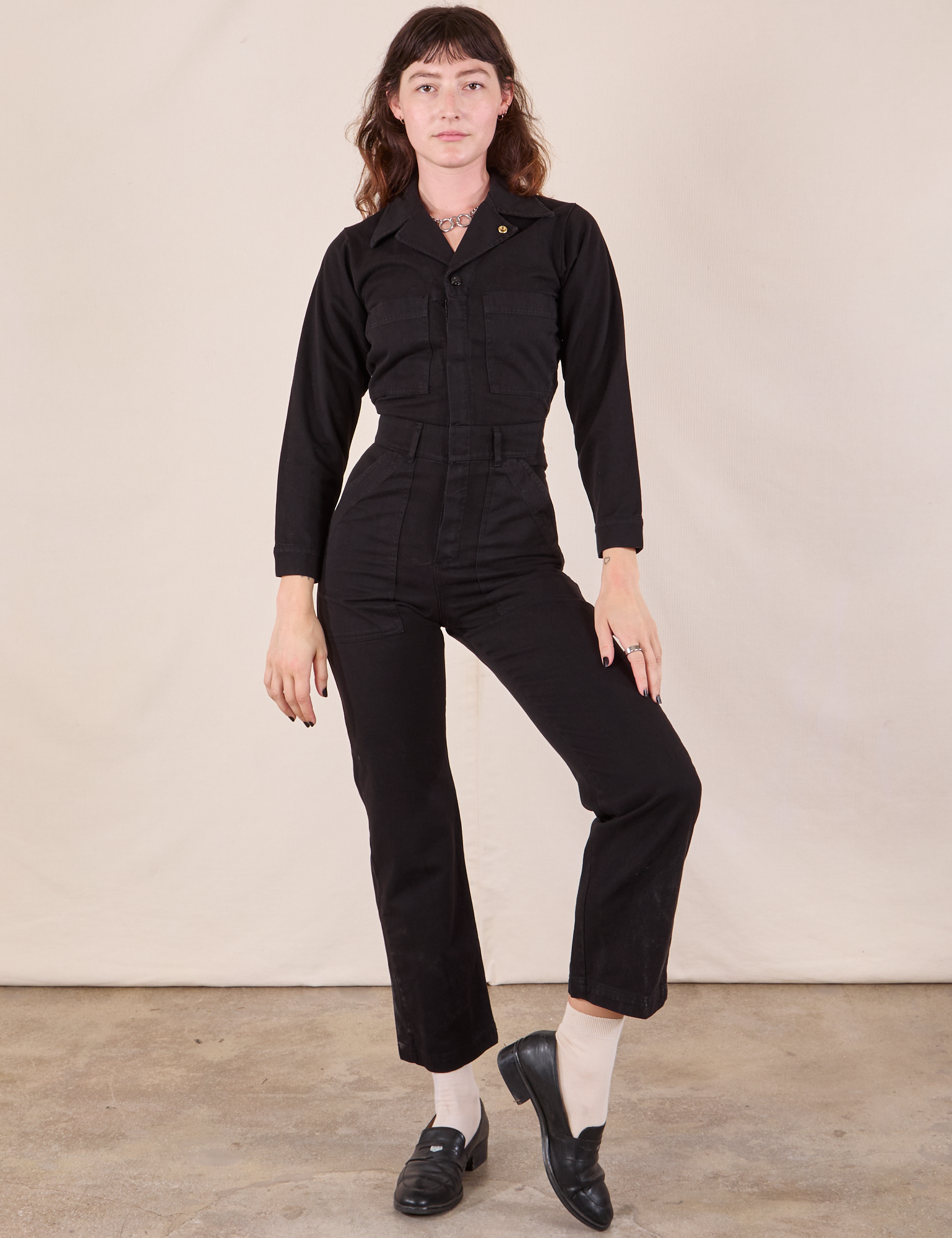 Alex is 5&#39;8&quot; and wearing XXS Long Sleeve Jumpsuit in Basic Black