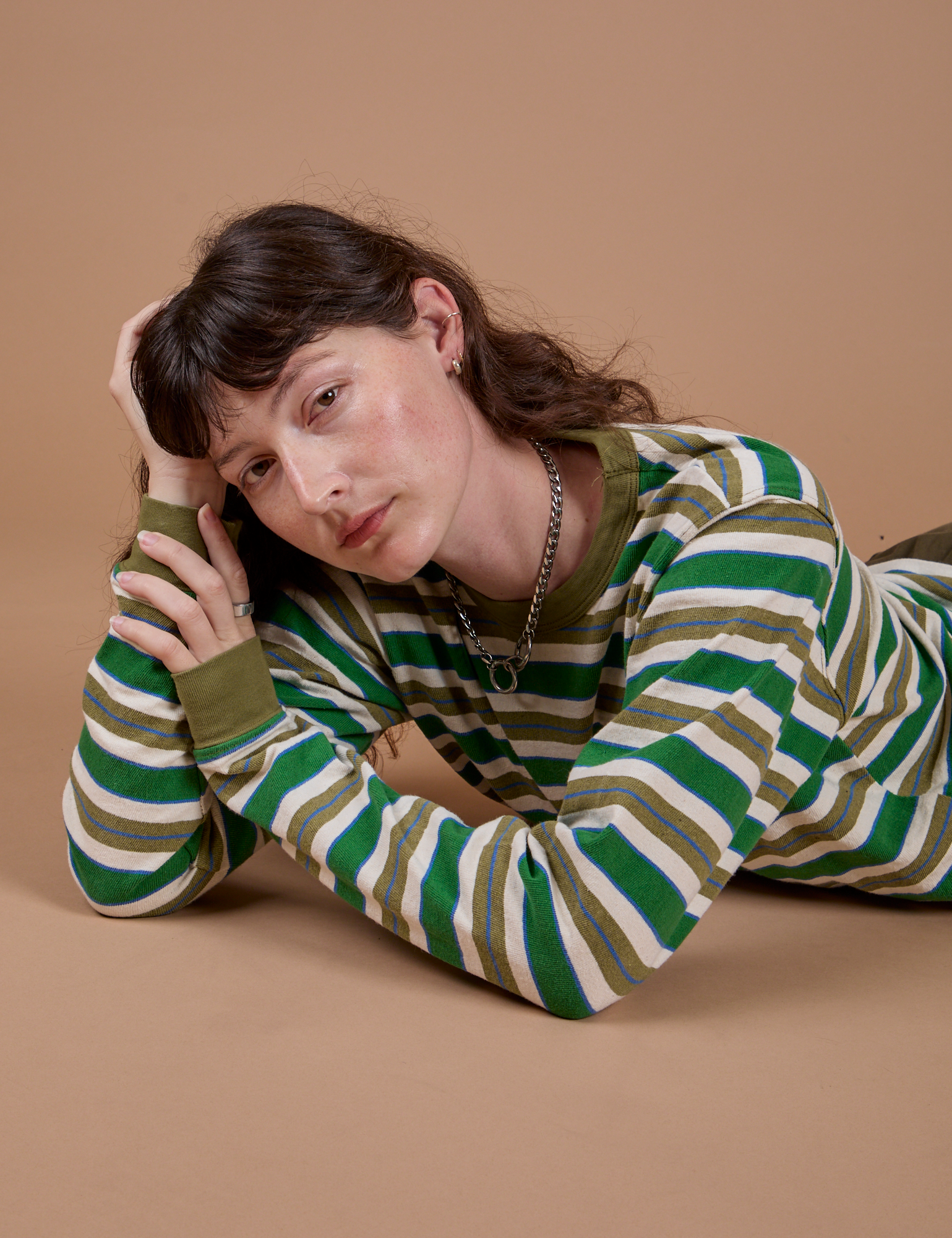 Alex is wearing Long Sleeve Striped Burly Tee in Green