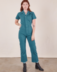 Alex is wearing Short Sleeve Jumpsuit in Marine Blue