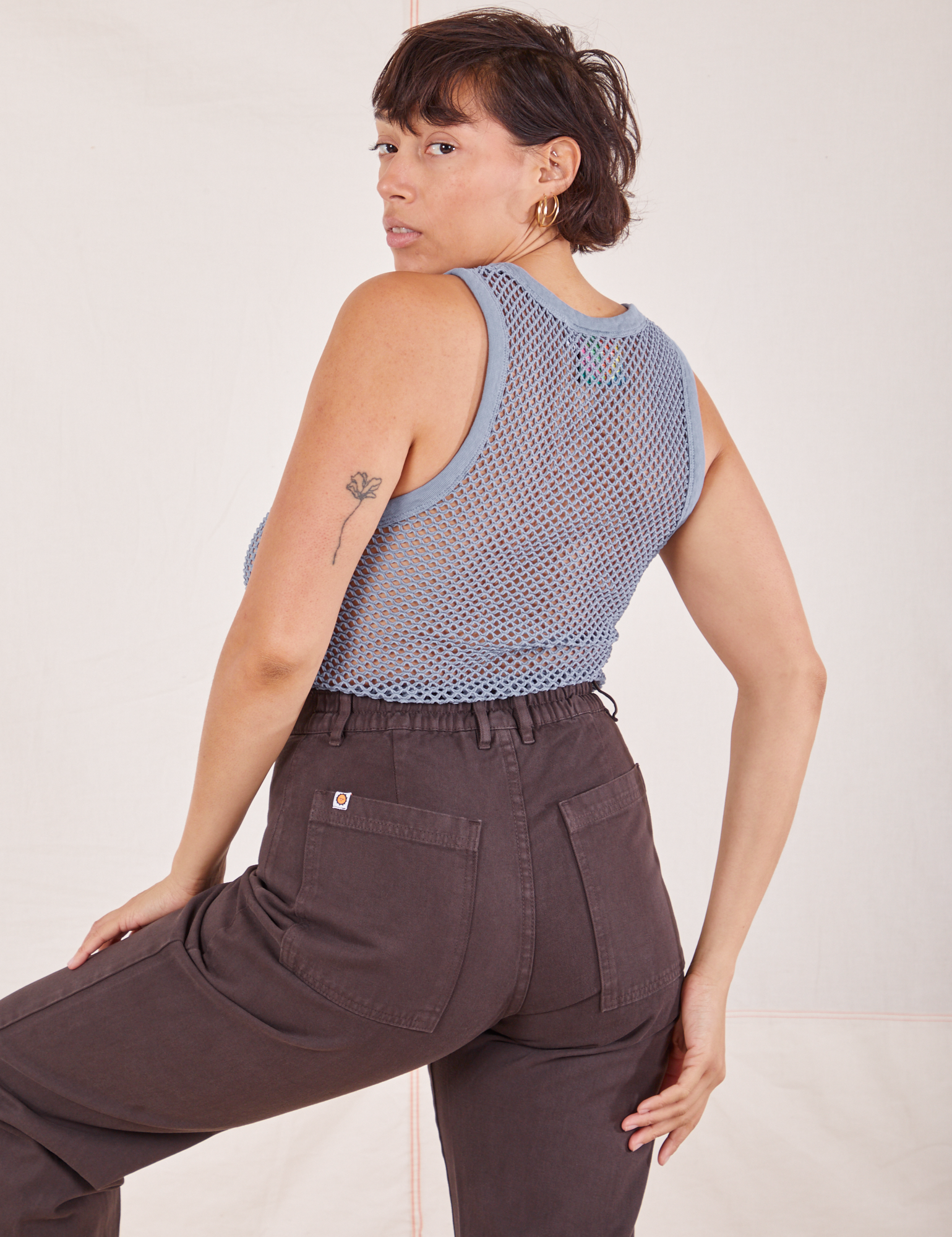 Angled back view of Mesh Tank Top in Periwinkle and espresso brown Western Pants worn by Tiara