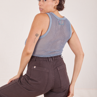 Angled back view of Mesh Tank Top in Periwinkle and espresso brown Western Pants worn by Tiara