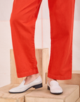 Mid-Rise Pleated Trousers in Chili Red pant leg close up on Alex