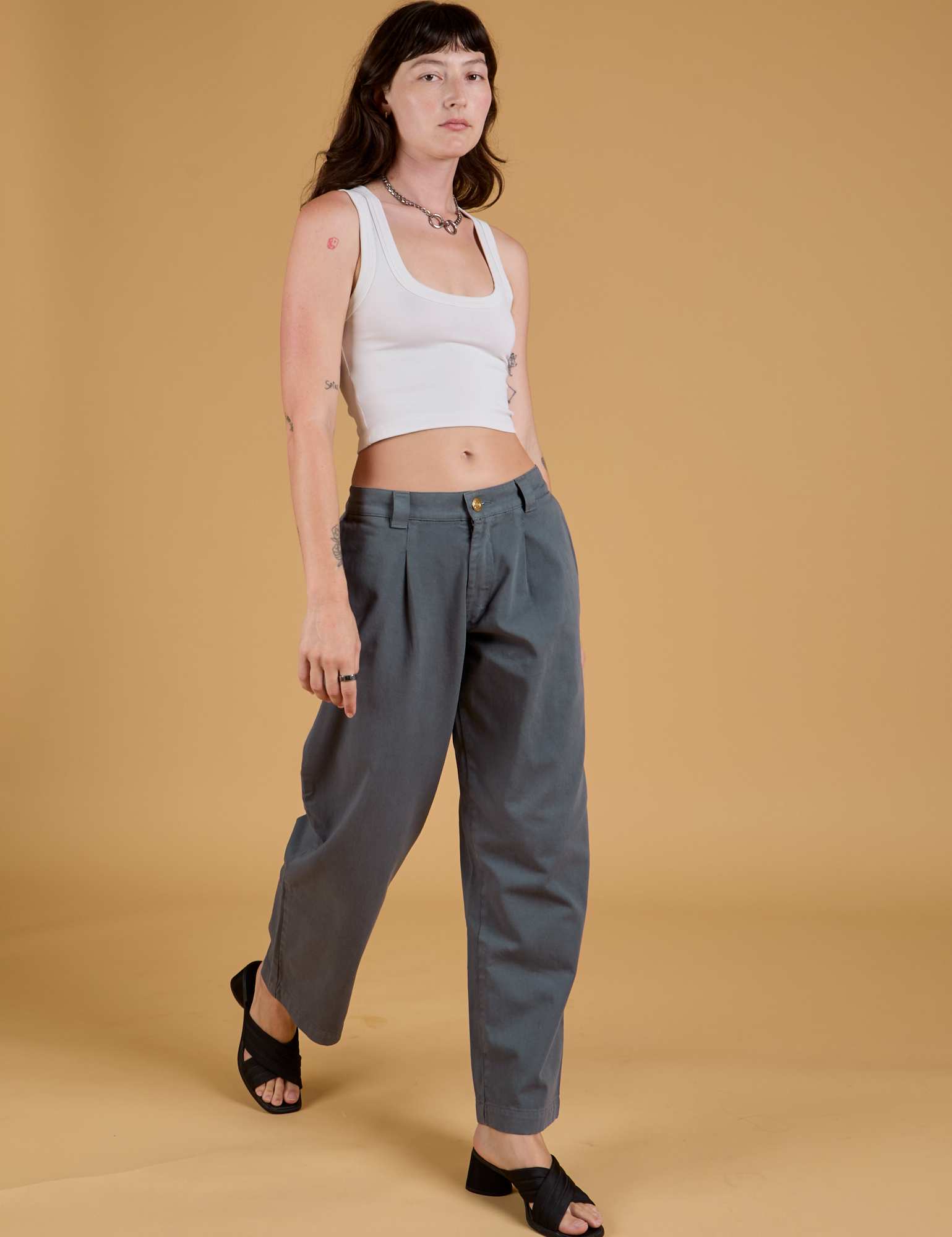 Baggy Mid-Rise Trousers in Slate Grey and vintage tee white Cropped Tank on Alex