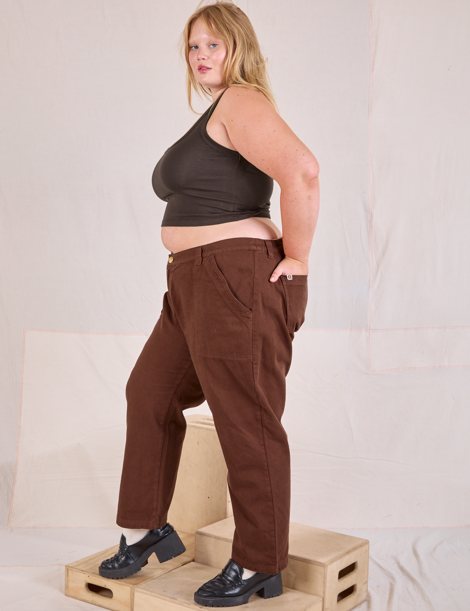 Side view of Mid-Rise Work Pants in Fudgesicle Brown and espresso brown Cropped Tank on Juliet