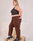 Side view of Mid-Rise Work Pants in Fudgesicle Brown and espresso brown Cropped Tank on Juliet