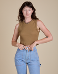 Alex is 5’8” and wearing XP Muscle Tee in Desert Brown