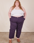 Catie is 5'11" and wearing 5XL Work Pants in Nebula Purple and vintage off-white Cami