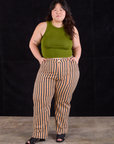 Ashley is 5'7" and wearing 1XL Work Pants in Autumn Stripe paired with summer olive Racerback Tank