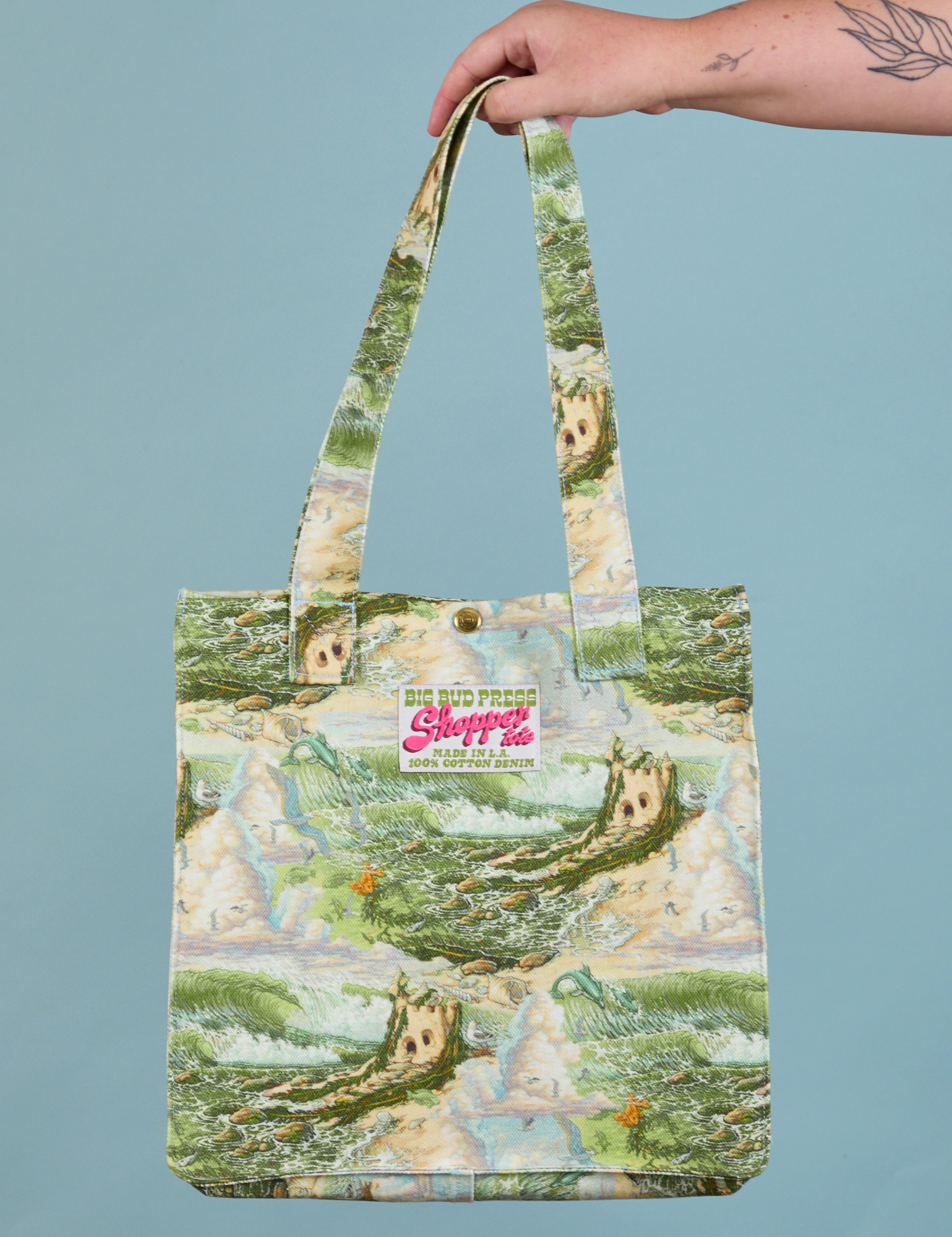 Ocean and Sky Printed Shopper Tote held by person