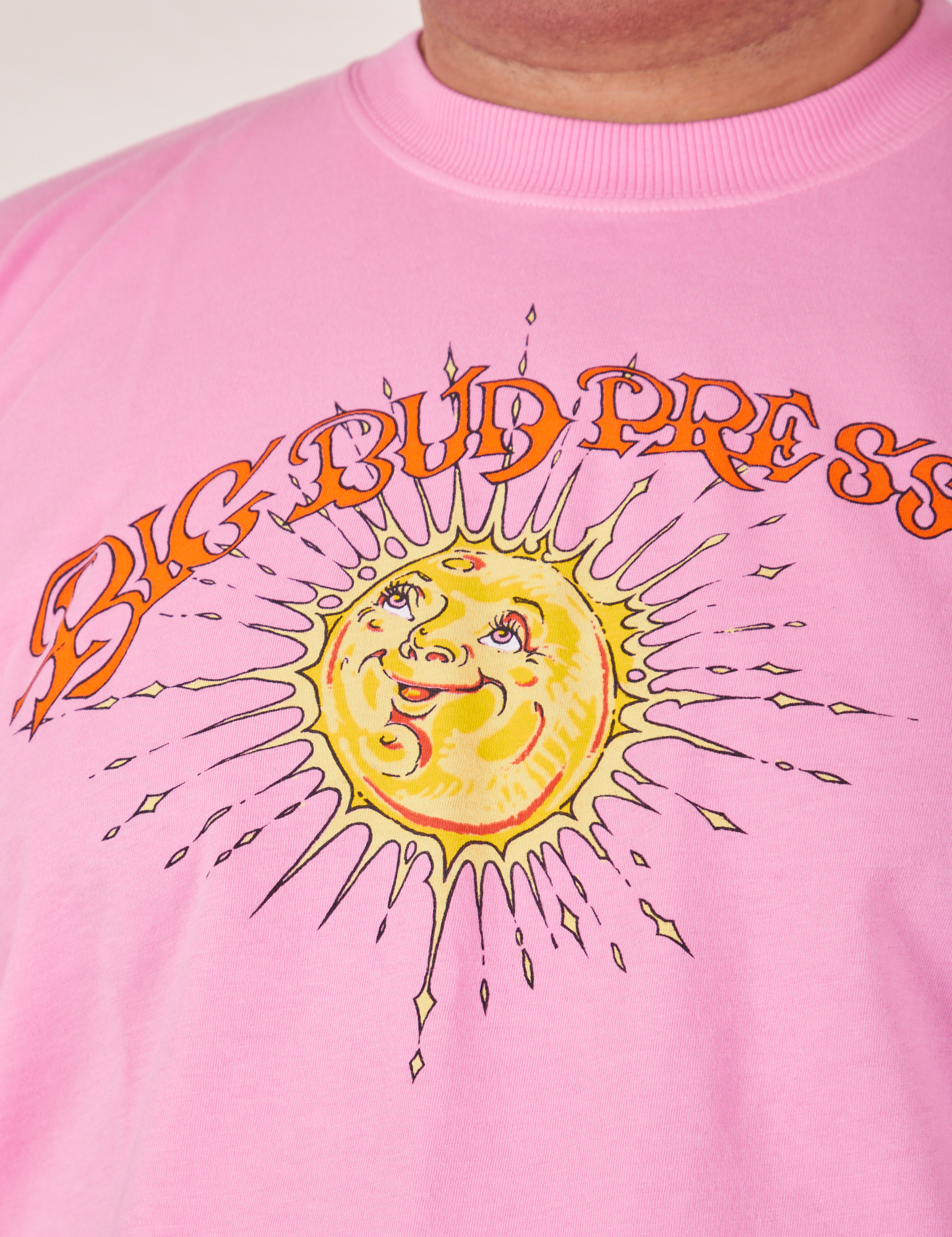 Sun Baby Organic Tee in Bubblegum Pink front close up on Miguel