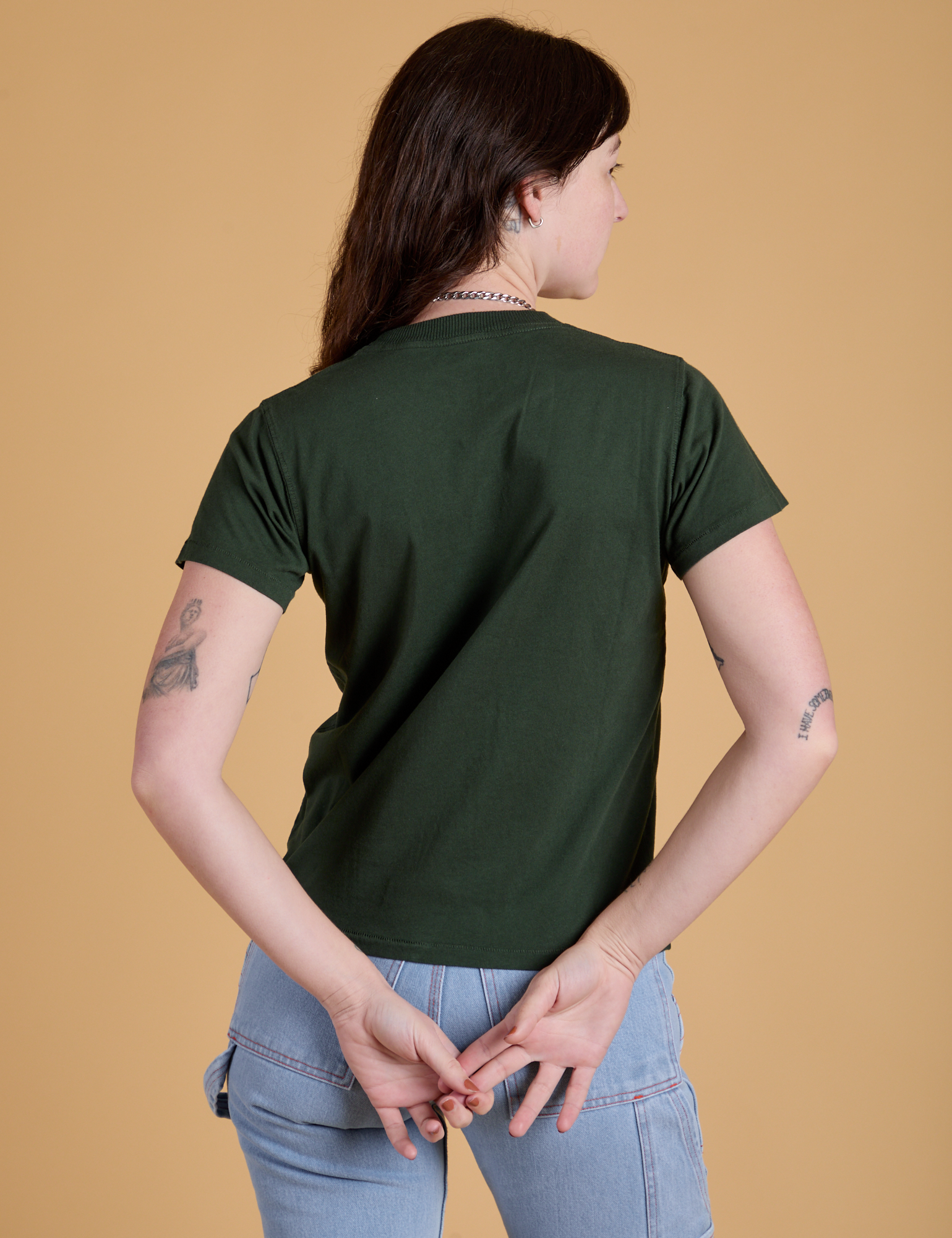 Organic Vintage Tee in Swamp Green back view on Alex