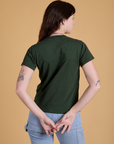 Organic Vintage Tee in Swamp Green back view on Alex