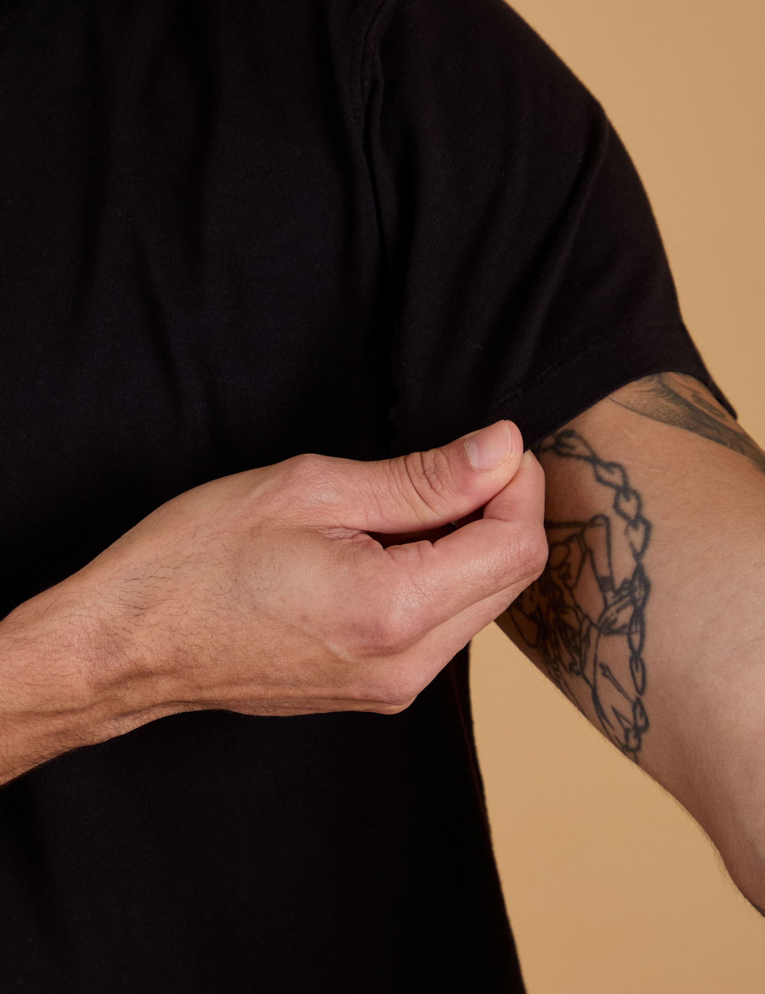 Sleeve close up of Organic Vintage Tee in Basic Black on Jesse